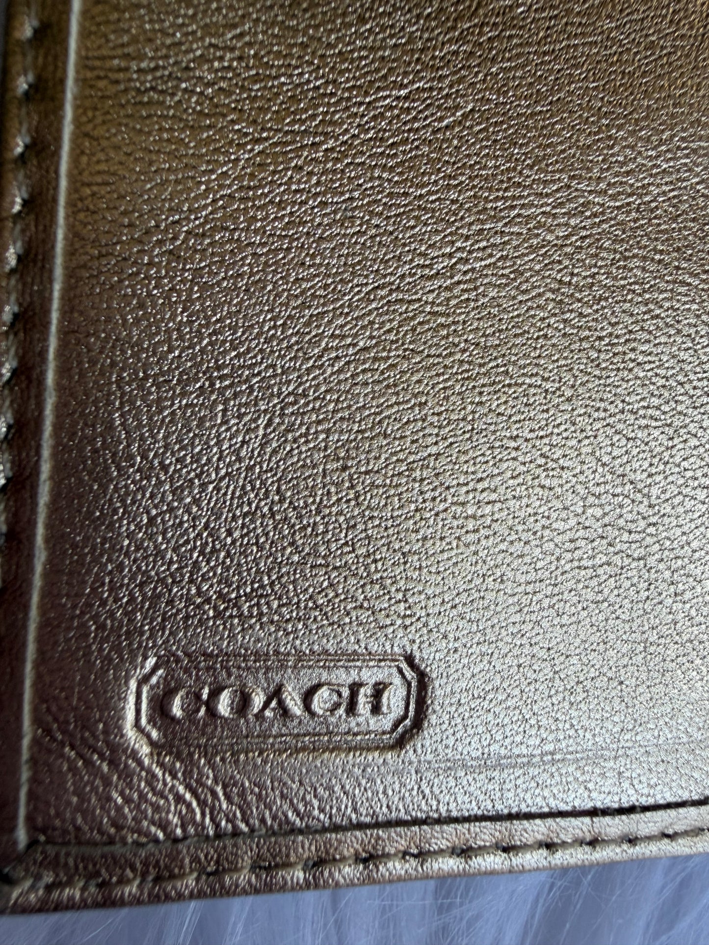 Coach signature canvas wallet with gold metallic trim